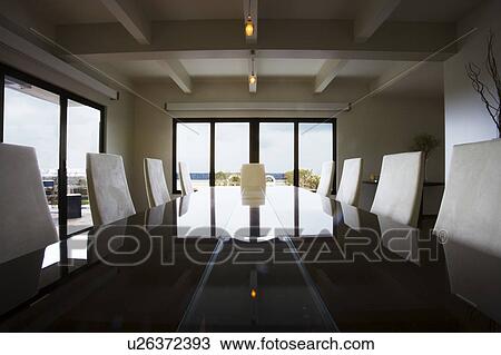 Stock Image - Modern Dining Room with Reflective Table. Fotosearch