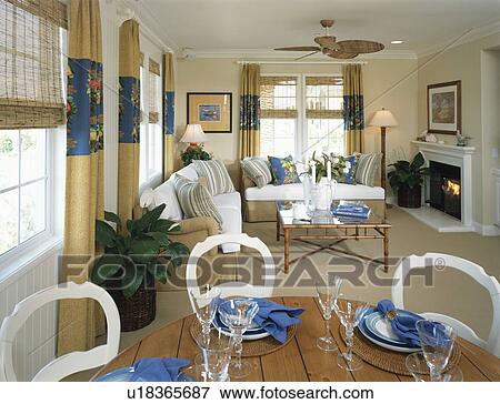 Stock Photo - Traditional Living Room and Dining Room with Fireplace. Fotosearch