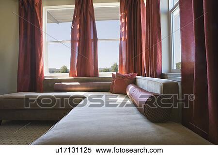 Stock Photography - White contemporary sofa with red accents. Fotosearch