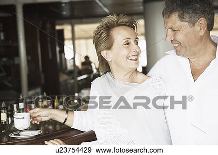 Stock Photo - Close-up of a couple looking at each other and smiling. Fotosearch