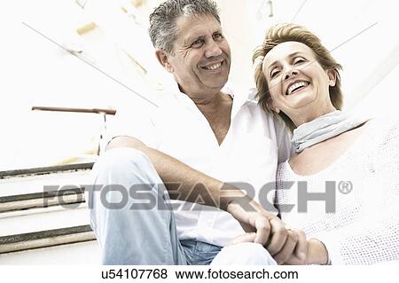Stock Photo - Close-up of a couple smiling. Fotosearch