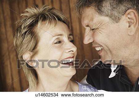 Close-up of a mature woman and a senior man looking at each other View Large Photo Image Picture - Close-up of a mature woman and a senior man looking at each other. Fotosearch