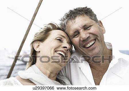 Close-up of a senior man and a mature woman smiling View Large Photo Image Stock Photograph - Close-up of a senior man and a mature woman smiling. Fotosearch