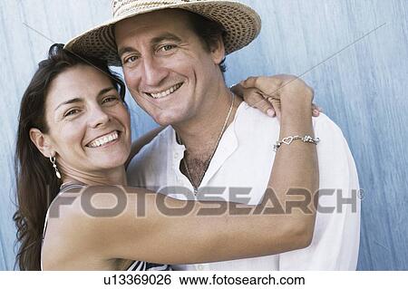 Portrait of a mid adult couple smiling View Large Photo Image Stock Photograph - Portrait of a mid adult couple smiling. Fotosearch