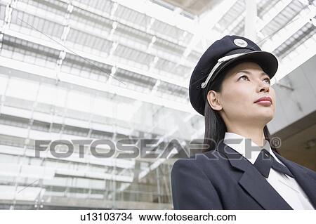 Low angle view of a female pilot View Large Photo Image Picture - Low angle view of a female pilot. Fotosearch