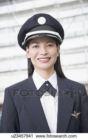 Portrait of a female pilot smiling View Large Photo Image Stock Image - Portrait of a female pilot smiling. Fotosearch