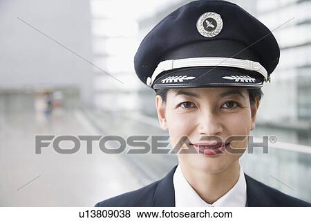 Portrait of a female pilot smiling View Large Photo Image Stock Photo - Portrait of a female pilot smiling. Fotosearch