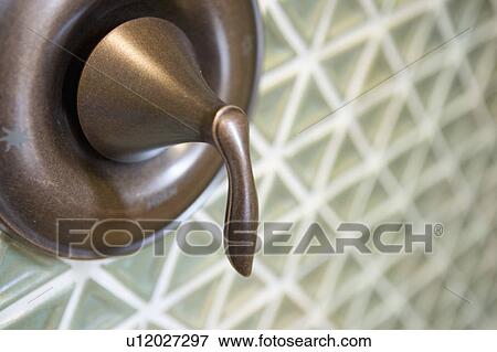 Bronze shower faucet close up View Large Photo Image Stock Photo - Bronze shower faucet close up. Fotosearch