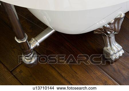 Picture - Claw Foot Bathtub Detail and Hardwood Floor. Fotosearch