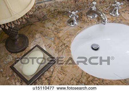 Detail of bathroom sink with chrome faucet and soap dish View Large Photo Image Stock Photo - Detail of bathroom sink with chrome faucet and soap dish. Fotosearch
