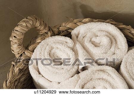 Detail of rolled towels in basket View Large Photo Image Stock Photo - Detail of rolled towels in basket. Fotosearch