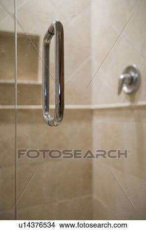 Glass shower door with chrome handle View Large Photo Image Picture - Glass shower door with chrome handle. Fotosearch