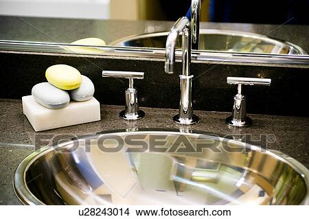 Metal bathroom sink and faucet View Large Photo Image Picture - Metal bathroom sink and faucet. Fotosearch