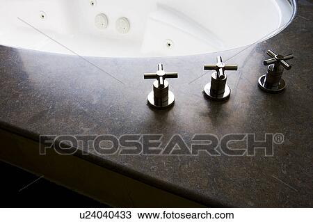 Stock Image - Modern bath suite with spa. Fotosearch