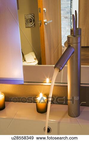 Stock Photo - Modern Bathroom Faucet and Candle. Fotosearch