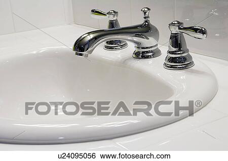 Stock Photograph - Traditional White Sink with Chrome Faucet. Fotosearch