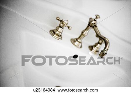 White sink and vintage chrome faucet View Large Photo Image Picture - White sink and vintage chrome faucet. Fotosearch