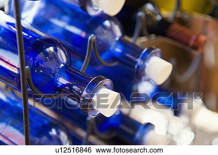Stock Photograph - Blue Wine Bottles with White Corks. Fotosearch