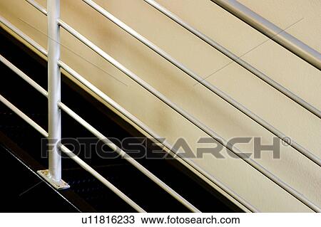 Stock Image - Contemporary metal staircase railing. Fotosearch