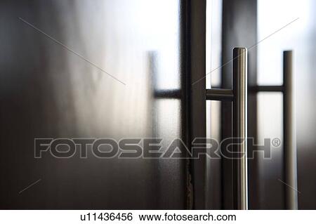 Detail of chrome handles on dark wood. View Large Photo Image Stock Photograph - Detail of chrome handles on dark wood.. Fotosearch