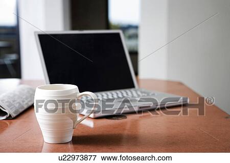 Laptop and coffee mug View Large Photo Image Stock Photo - Laptop and coffee mug. Fotosearch