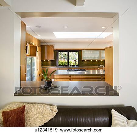 Leather Sofa in Modern Living Room with Cutout to Kitchen View Large Photo Image Stock Photo - Leather Sofa in Modern Living Room with Cutout to Kitchen. Fotosearch