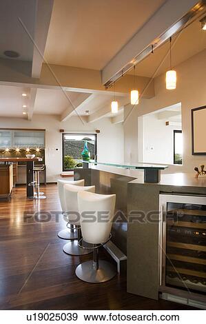 Modern Wet Bar With Raised Glass Countertop Stock Photo