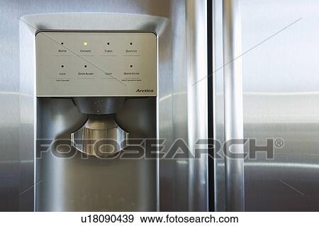 Stock Photo - Refrigerator door with water and ice dispenser. Fotosearch