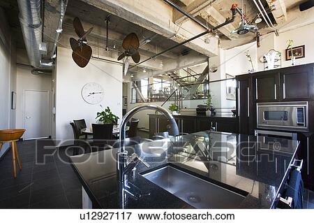 Stock Photo - Vignette of modern kitchen. Fotosearch