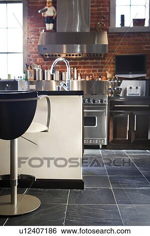 Stock Photograph - Vignette of modern kitchen. Fotosearch