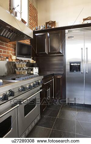 Stock Photo - Vignette of stainless steel appliances. Fotosearch