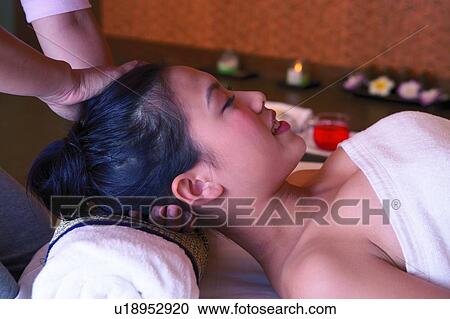 Young woman having neck massaged, eyes closed, close-up, side view View Large Photo Image Stock Image - Young woman having neck massaged, eyes closed, close-up, side view. Fotosearch