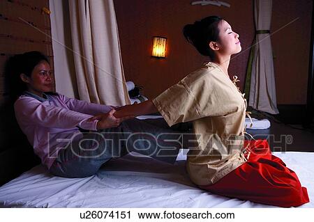 Young woman receiving massage at spa View Large Photo Image Stock Image - Young woman receiving massage at spa. Fotosearch