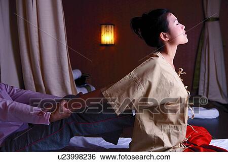 Young woman receiving massage at spa View Large Photo Image Stock Photograph - Young woman receiving massage at spa. Fotosearch
