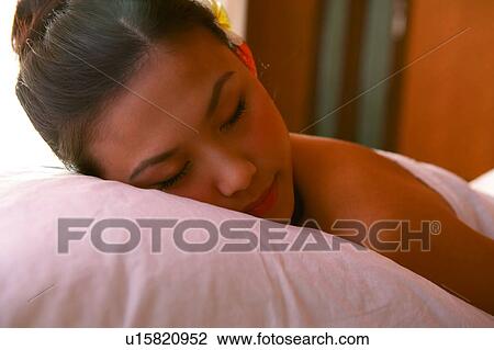 Young woman wearing towel, lying View Large Photo Image Stock Image - Young woman wearing towel, lying. Fotosearch
