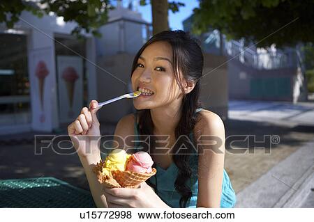 Young Lady Eating Ice-Cream View Large Photo Image Stock Photo - Young Lady Eating Ice-Cream. Fotosearch
