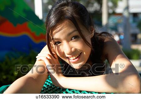 Young Lady Resting on Table in Park View Large Photo Image Stock Image - Young Lady Resting on Table in Park. Fotosearch