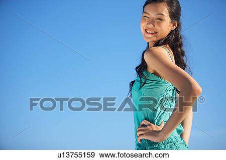 Young Lady Standing, Hands on Hips, Smiling View Large Photo Image Stock Photo - Young Lady Standing, Hands on Hips, Smiling. Fotosearch