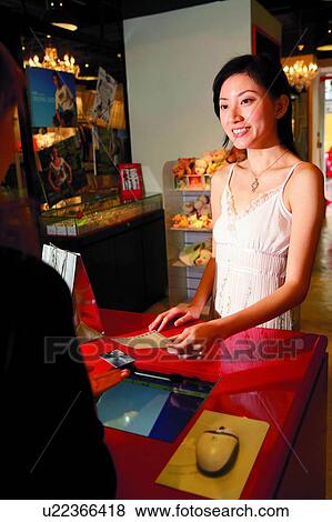 Young woman using credit card to pay money View Large Photo Image Stock Photo - Young woman using credit card to pay money. Fotosearch