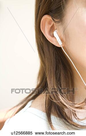 Stock Photography - Woman listening music. Fotosearch