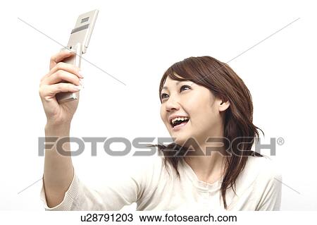 Woman looking at cell phone View Large Photo Image Stock Image - Woman looking at cell phone. Fotosearch