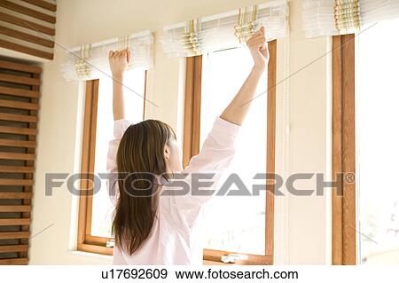 Stock Photo - Woman stretching herself. Fotosearch