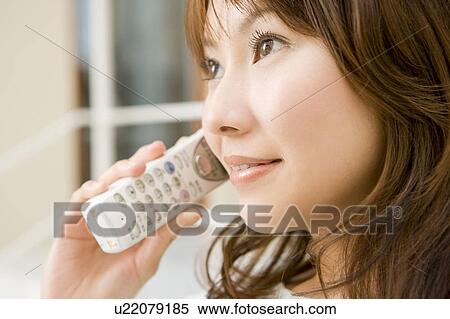 Stock Photography - Woman talking on cell phone. Fotosearch