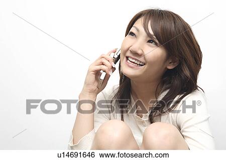 Woman talking with cell phone View Large Photo Image Stock Photograph - Woman talking with cell phone. Fotosearch