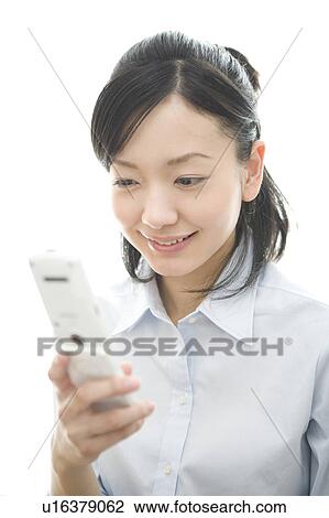 Stock Image - Woman watching a cell phone. Fotosearch