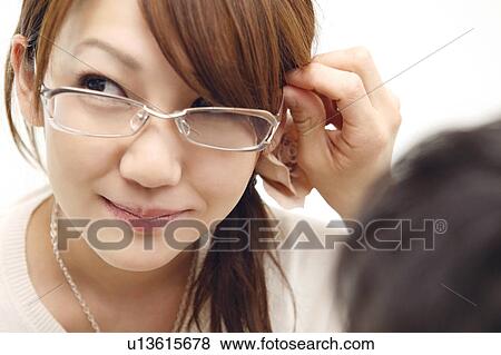 Woman wearing glasses View Large Photo Image Stock Photo - Woman wearing glasses. Fotosearch
