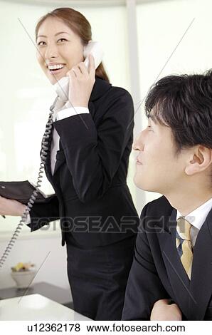 Stock Photo - Business lady who does the phone. Fotosearch