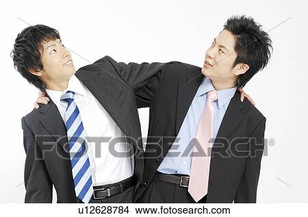 Picture - Businessmen grappling each shoulder. Fotosearch