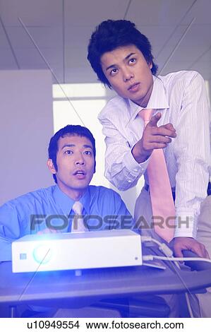 Businessmen having a meeting View Large Photo Image Picture - Businessmen having a meeting. Fotosearch