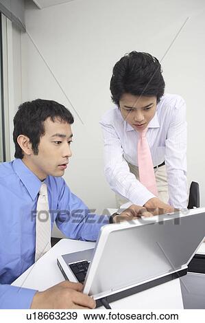 Businessmen having a meeting View Large Photo Image Stock Photo - Businessmen having a meeting. Fotosearch